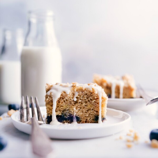 Piece of coffee cake on a plate, with a fork on the side.