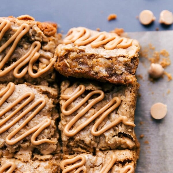 Oatmeal bars with peanut butter glaze on top ready to be enjoyed.