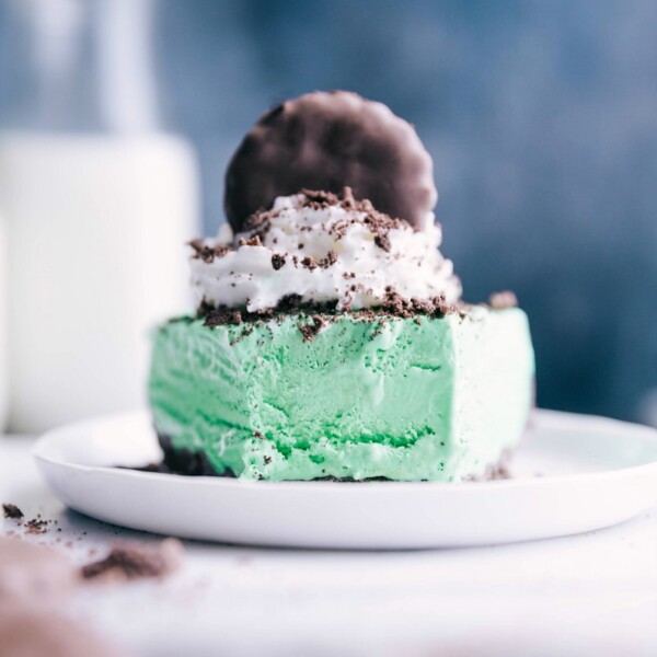 Slice of thin mint cheesecake with a bite revealing the creamy minty center.