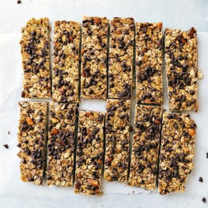 Delicious homemade granola bars, full of chocolate chips, cut into portions, and ready to be enjoyed.