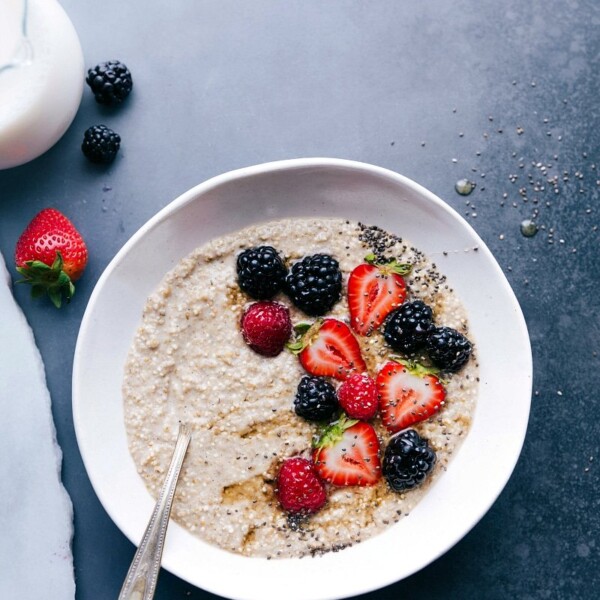 Delicious and warm overnight steel cut oatmeal topped with fresh berries, making a perfect breakfast dish.