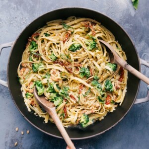 Creamy pesto pasta in a pot, ready to be served and enjoyed.