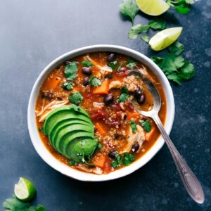 A bowl filled with chicken sweet potato soup, a healthy and hearty meal that's warm and full of flavor.