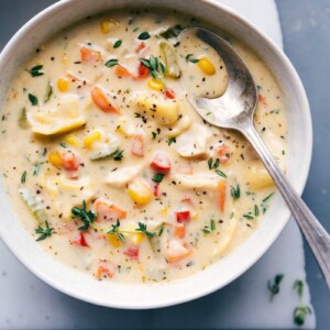 Finished dish with salt, pepper, and fresh herbs on top, served in a warm bowl.