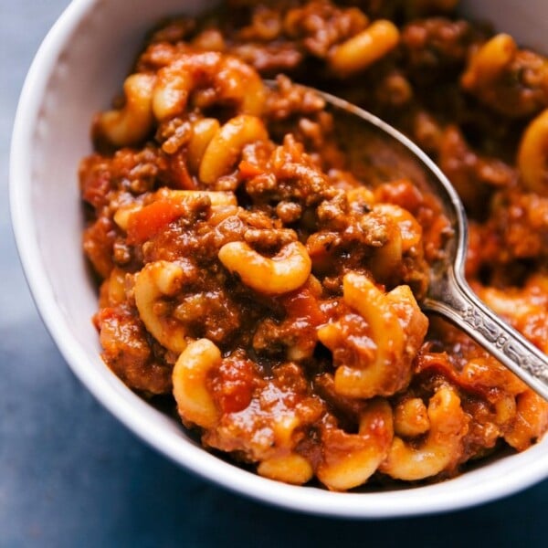 Bowl of american goulash with a spoon, ready to serve.