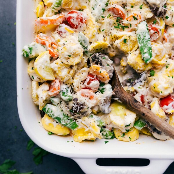 The finished tortellini casserole, delicious and cheesy, bursting with color and flavor.