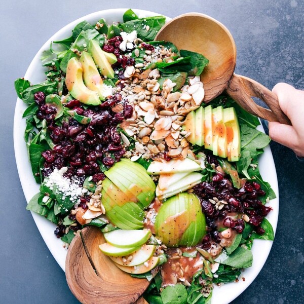 Quinoa and almond salad ready to be tossed together, all the fresh ingredients delicious and complimentary.