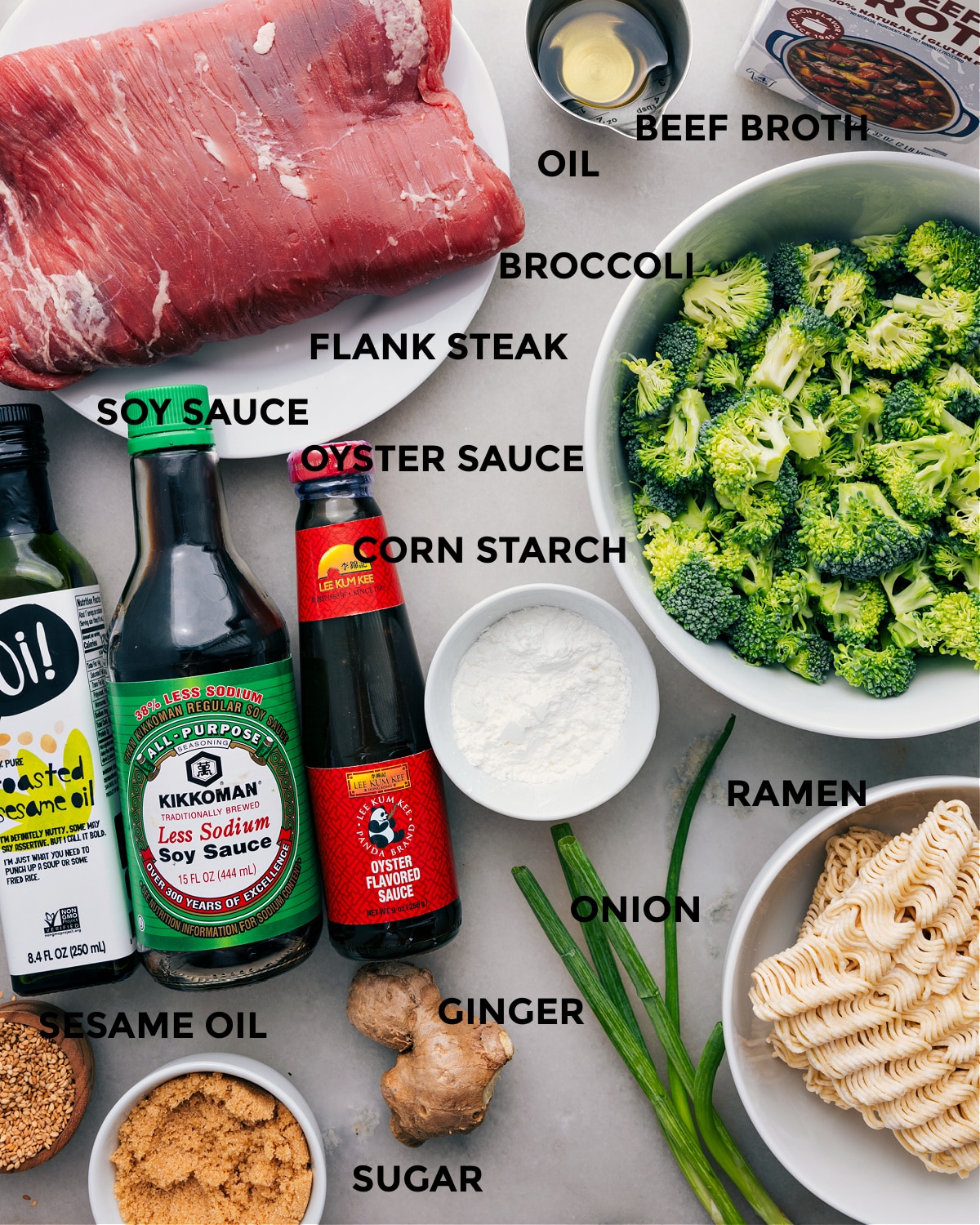 All the ingredients for this recipe are prepped and ready for easy assembly, including the meat, broccoli, steak, cornstarch, sauces, and noodles.