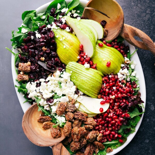 Pear salad recipe displayed in compartments, with each ingredient neatly arranged in its own spot.