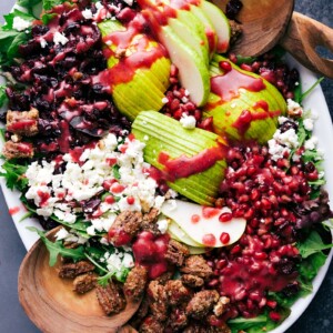 A salad using pears, about to be tossed and served, making it a delicious and healthy side dish.