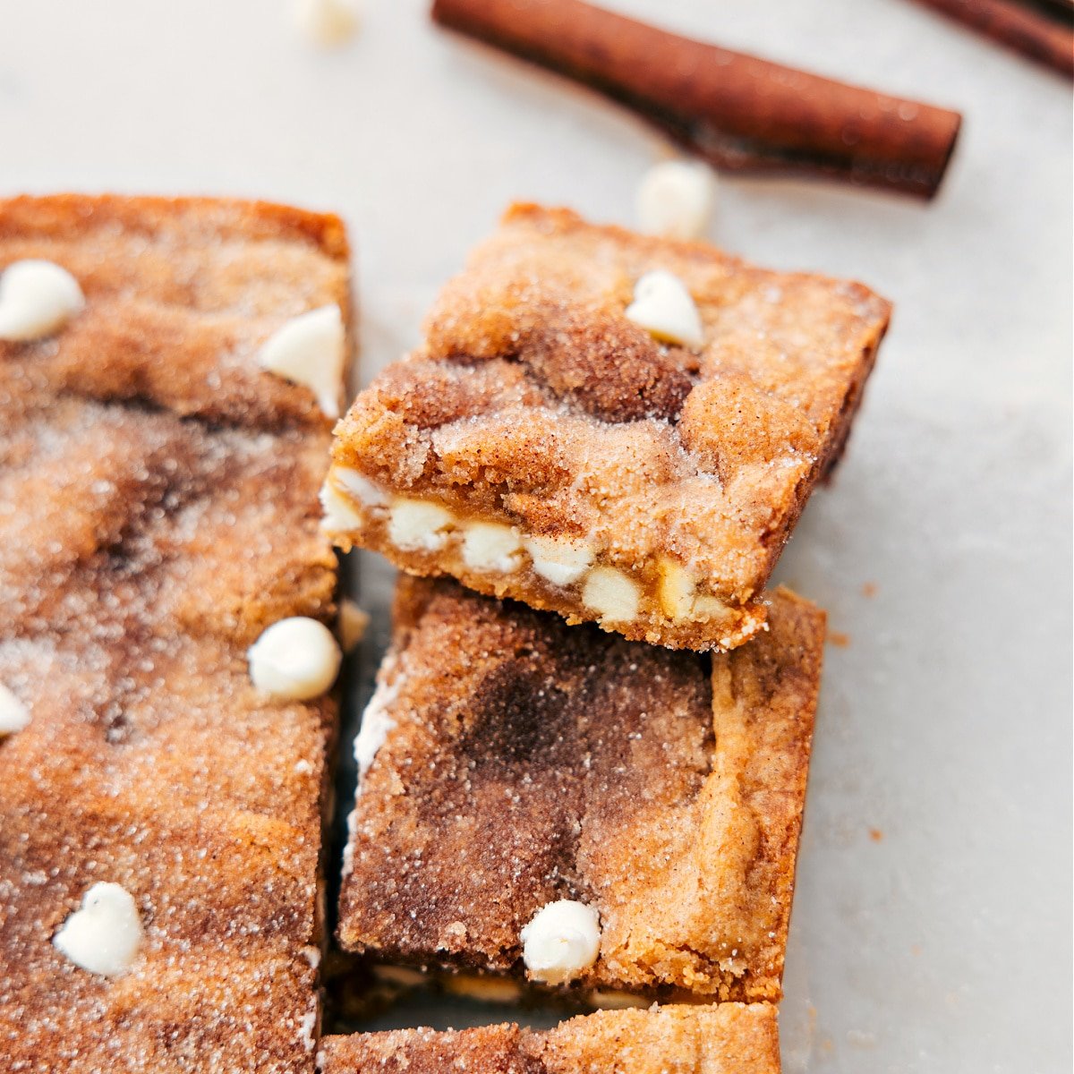 Snickerdoodle blondies cut into bars and ready to be enjoyed.