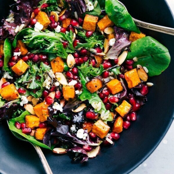 Bowl brimming with vibrant pomegranate salad, a cherished dish on our Thanksgiving dinner menu.