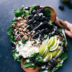 Blackberry salad with a light drizzle of poppy seed dressing, ready to be savored.