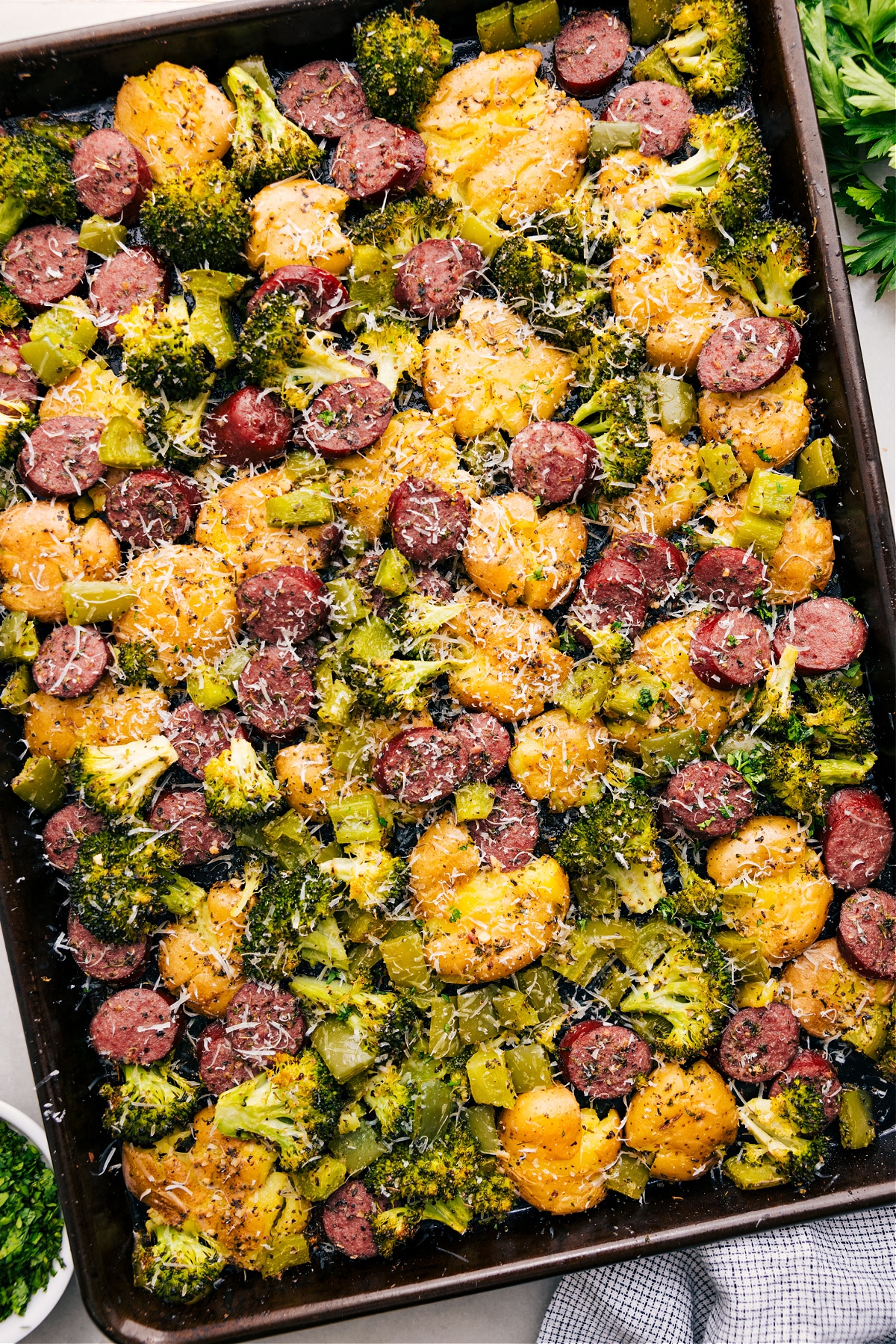 Sausage Potato Broccoli Sheet Pan with fresh parmesan on top.