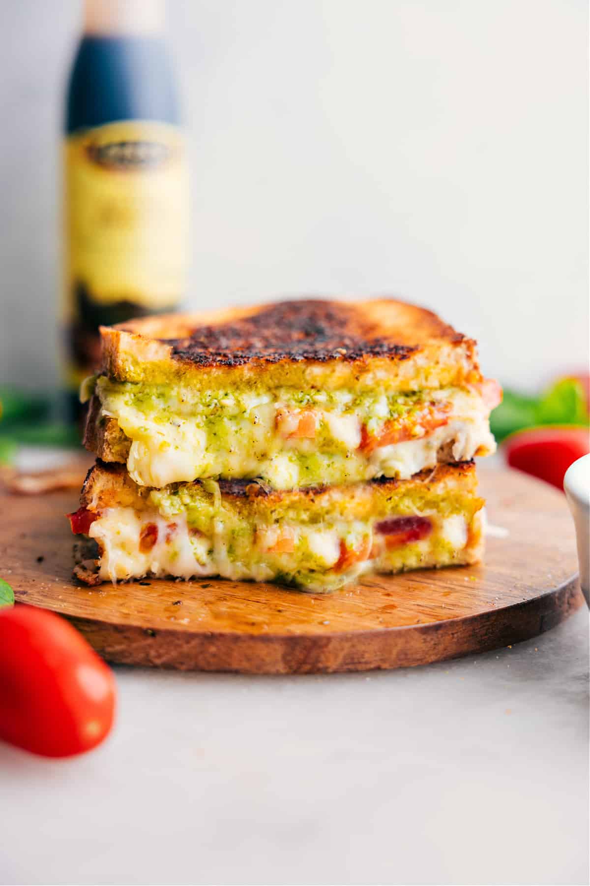 Caprese Grilled Cheese stacked on top of each other showing the cheesy center.