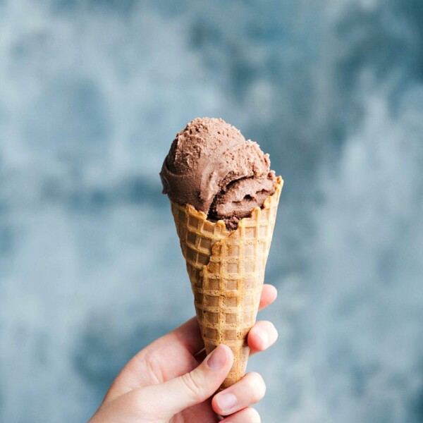 A waffle cone cone filled with rich and creamy chocolate gelato.