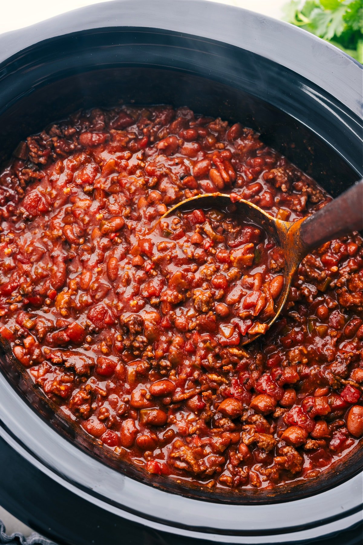 Crockpot Chili cooks in the slow cooker and is ready to enjoy.