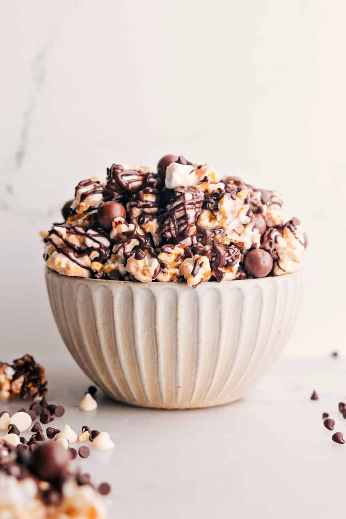 Chocolate Popcorn: Popcorn and chocolate malt balls mixed together in a bowl.