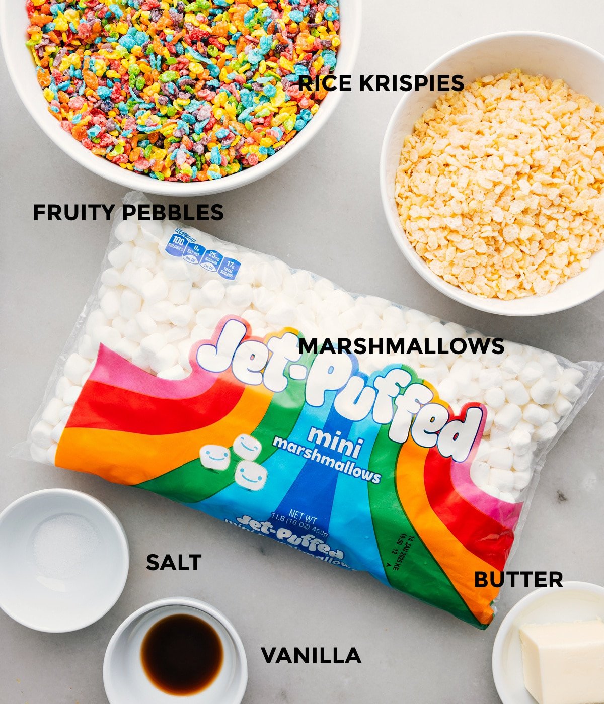 The ingredients in this recipe prepped out for easy assembly including the cereal, marshmallows, salt, vanilla, and butter.