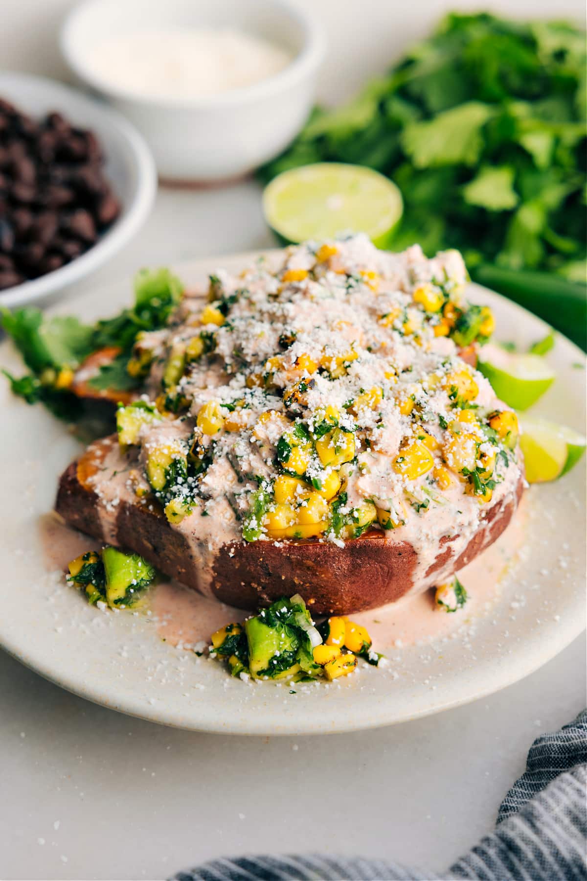 Mexican streeet corn loaded sweet potatoes topped with the most delicious sauce and cotija cheese. 