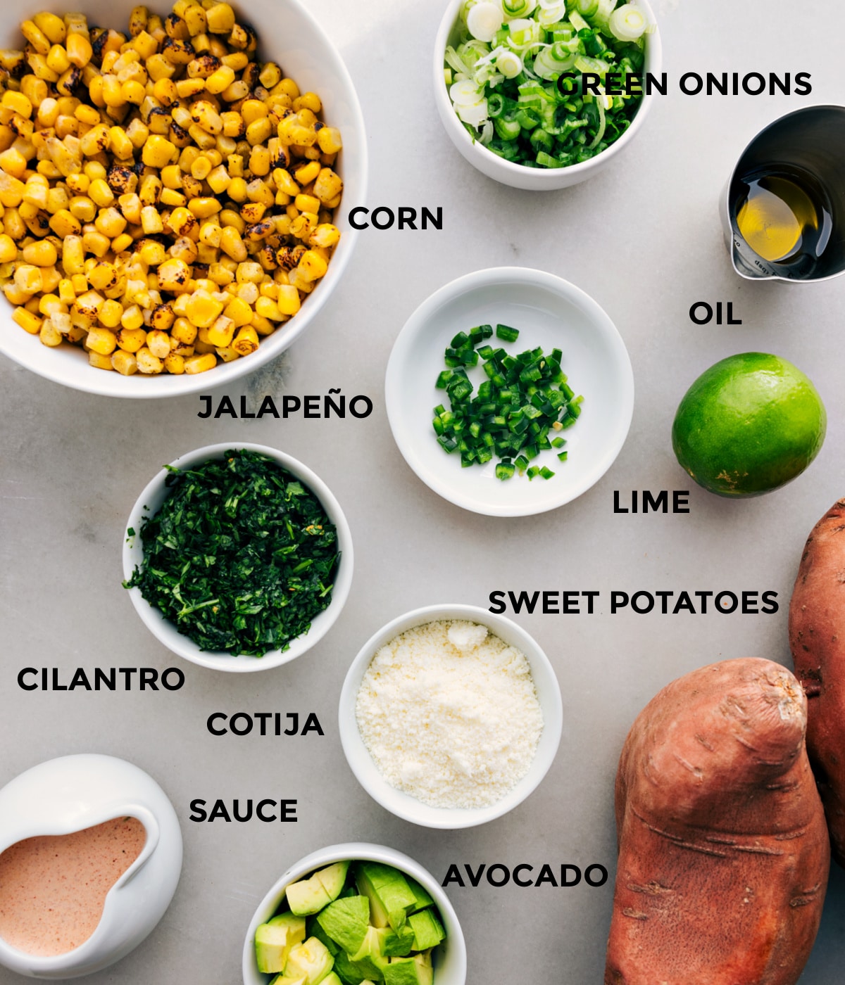 This recipe has everything prepped for easy assembly—corn, green onions, oil, lime, jalapeño, veggies, cotija, and sauce.