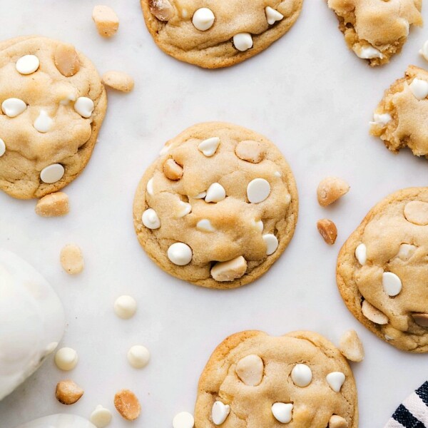 Baked White Chocolate Macadamia Nut Cookies on a board.