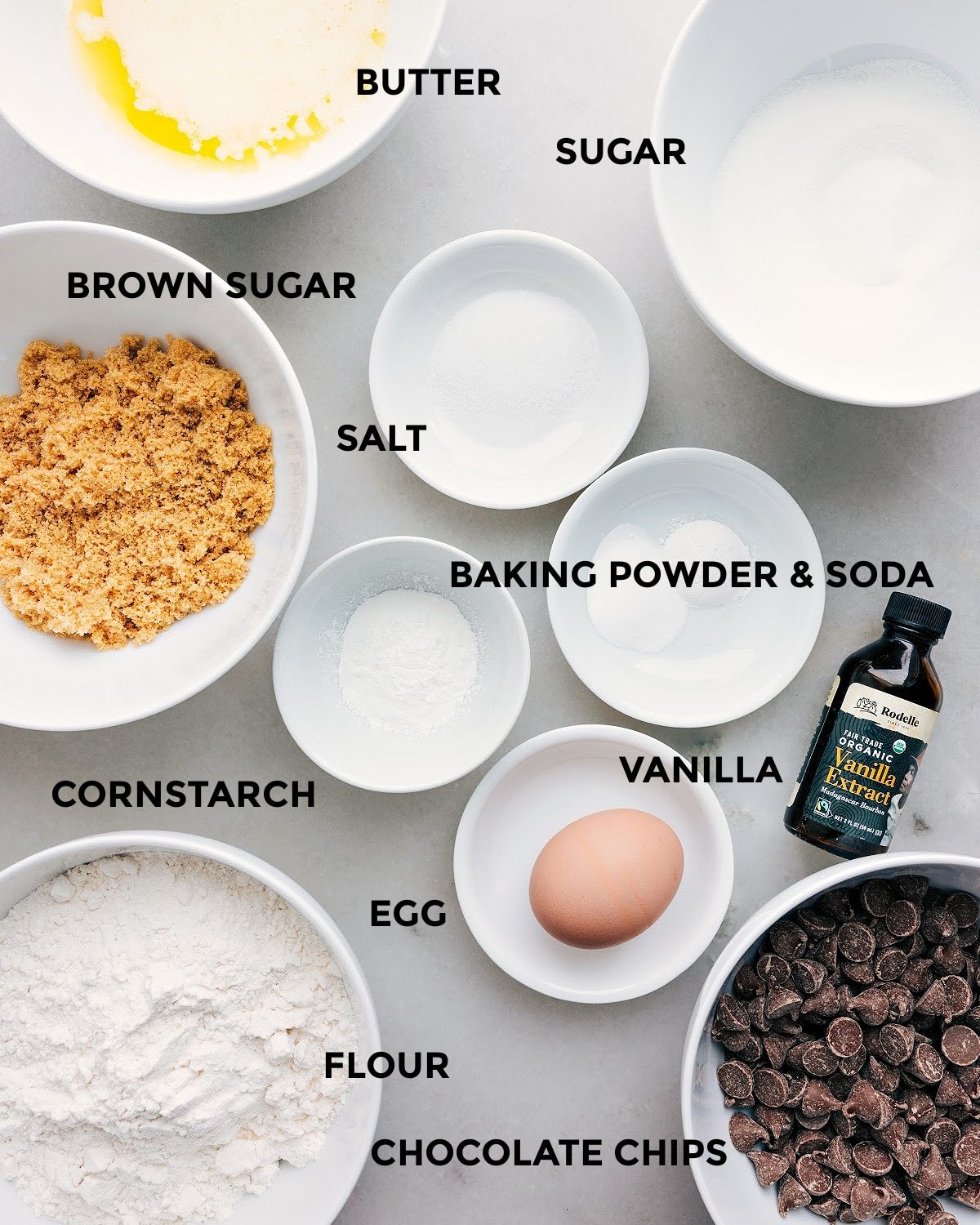 All the ingredients prepped for easy assembly: butter, sugar, salt, baking soda, baking powder, vanilla, cornstarch, egg, flour, and chocolate chips.