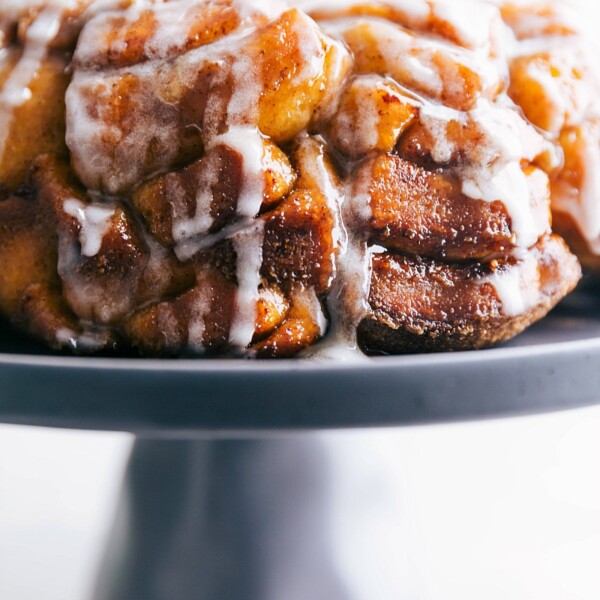 The finished cinnamon roll monkey bread recipe with the cream cheese frosting, showcasing the texture and flavor of this delightful dessert.