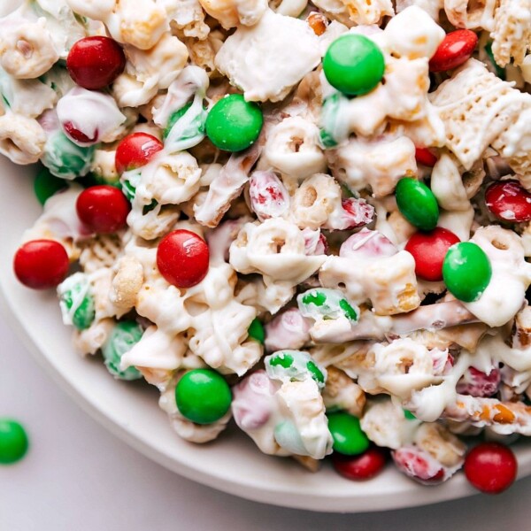 Christmas Snack Mix with festive green and red M&M's, generously coated in white chocolate.