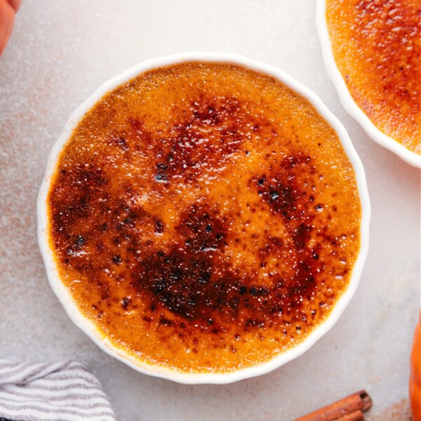 Golden caramelized sugar crust atop creamy Pumpkin Créme Brûleé in a ramekin.