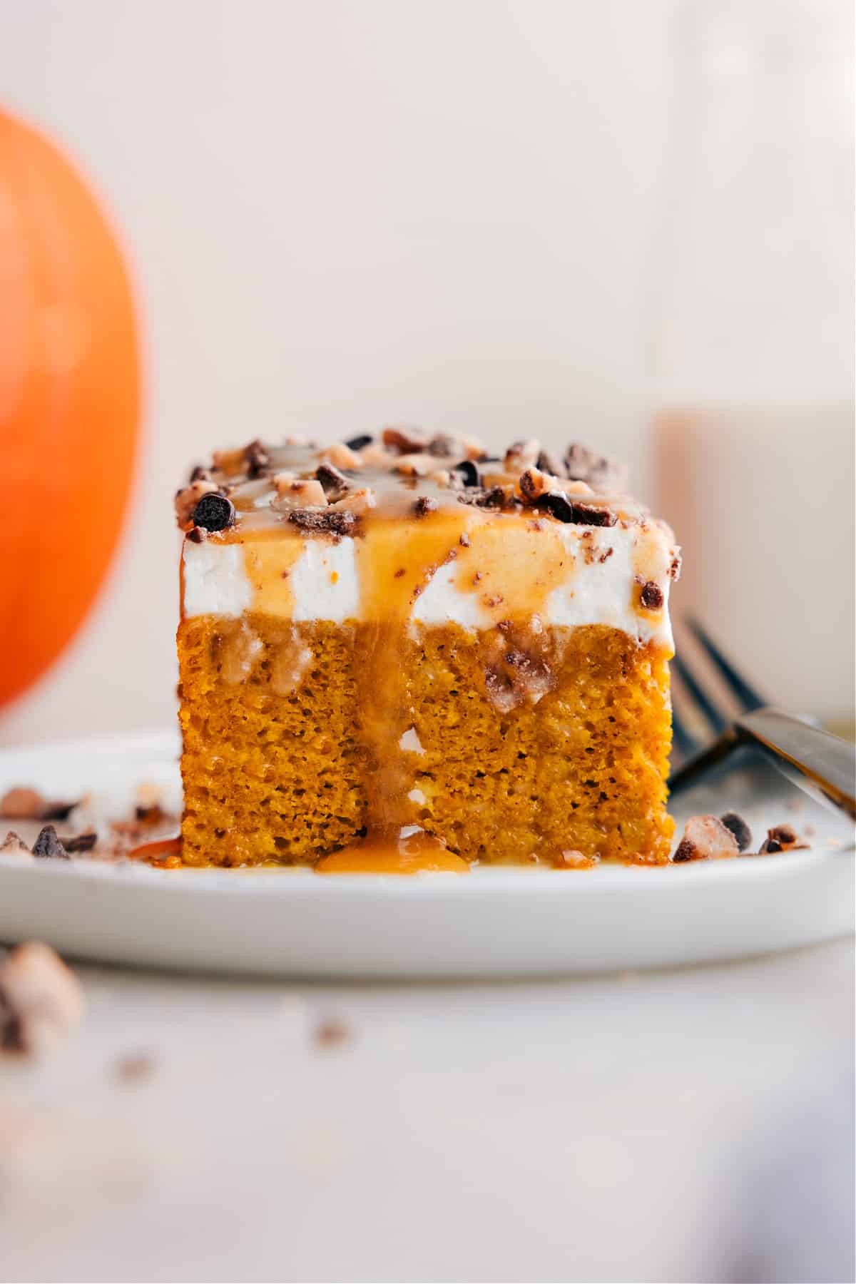 Cut the Pumpkin Poke Cake into squares and serve.