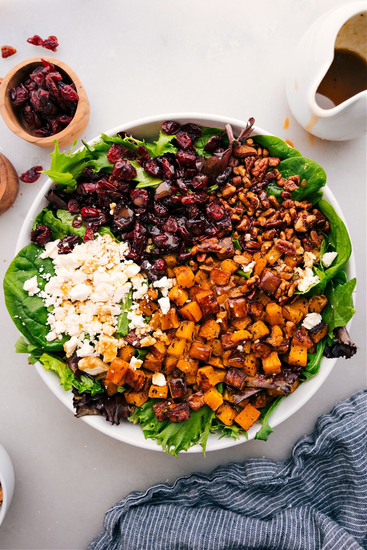 Thanksgiving Salad in a bowl, dressed and ready to serve.