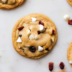 Warm, freshly baked cranberry white chocolate cookies, ready for indulgence.