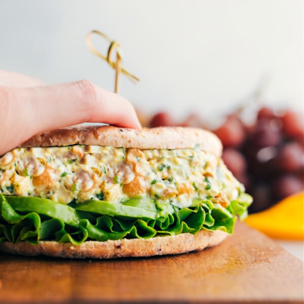 Curry Chicken Salad in a sandwich with lettuce and avocado, the perfect mix.