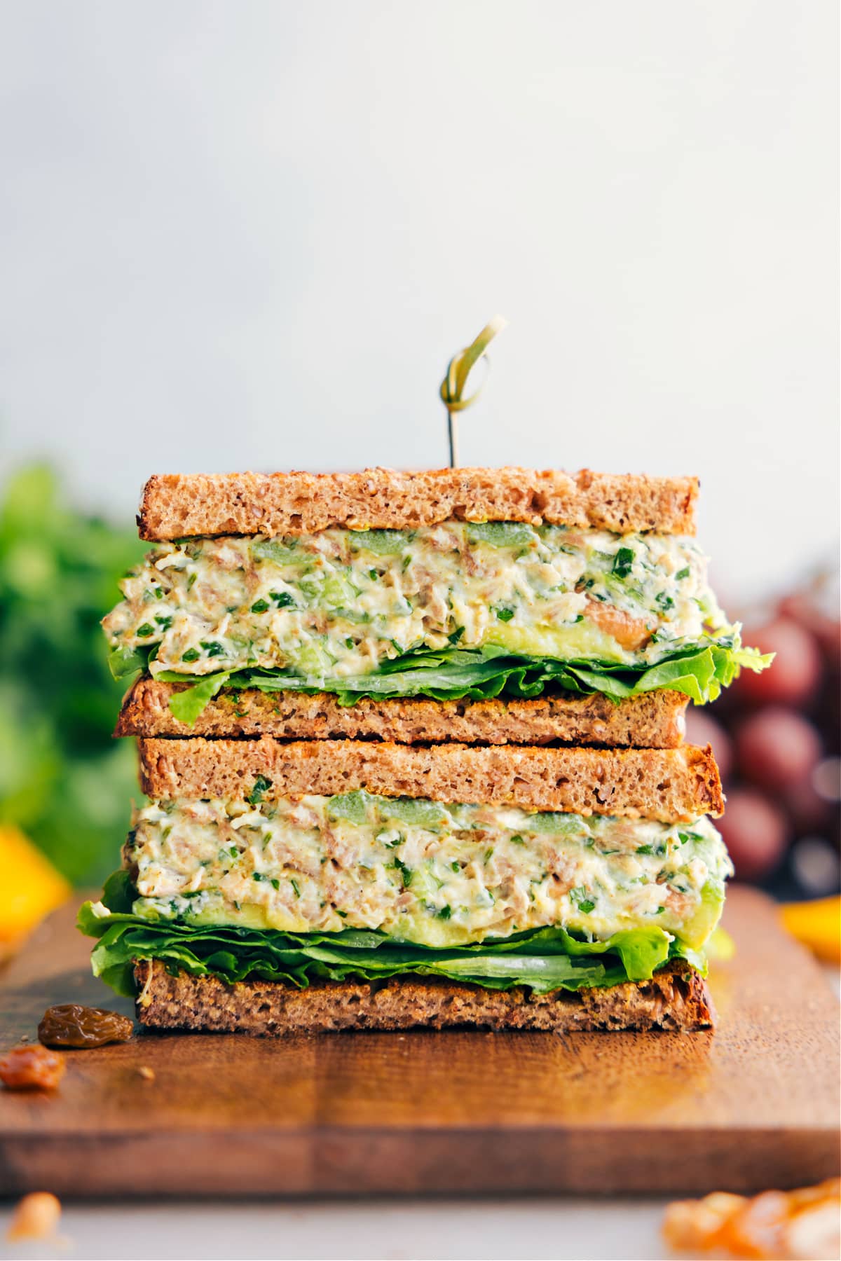 Curry Chicken Salad in whole grain bread stacked on top of each other.