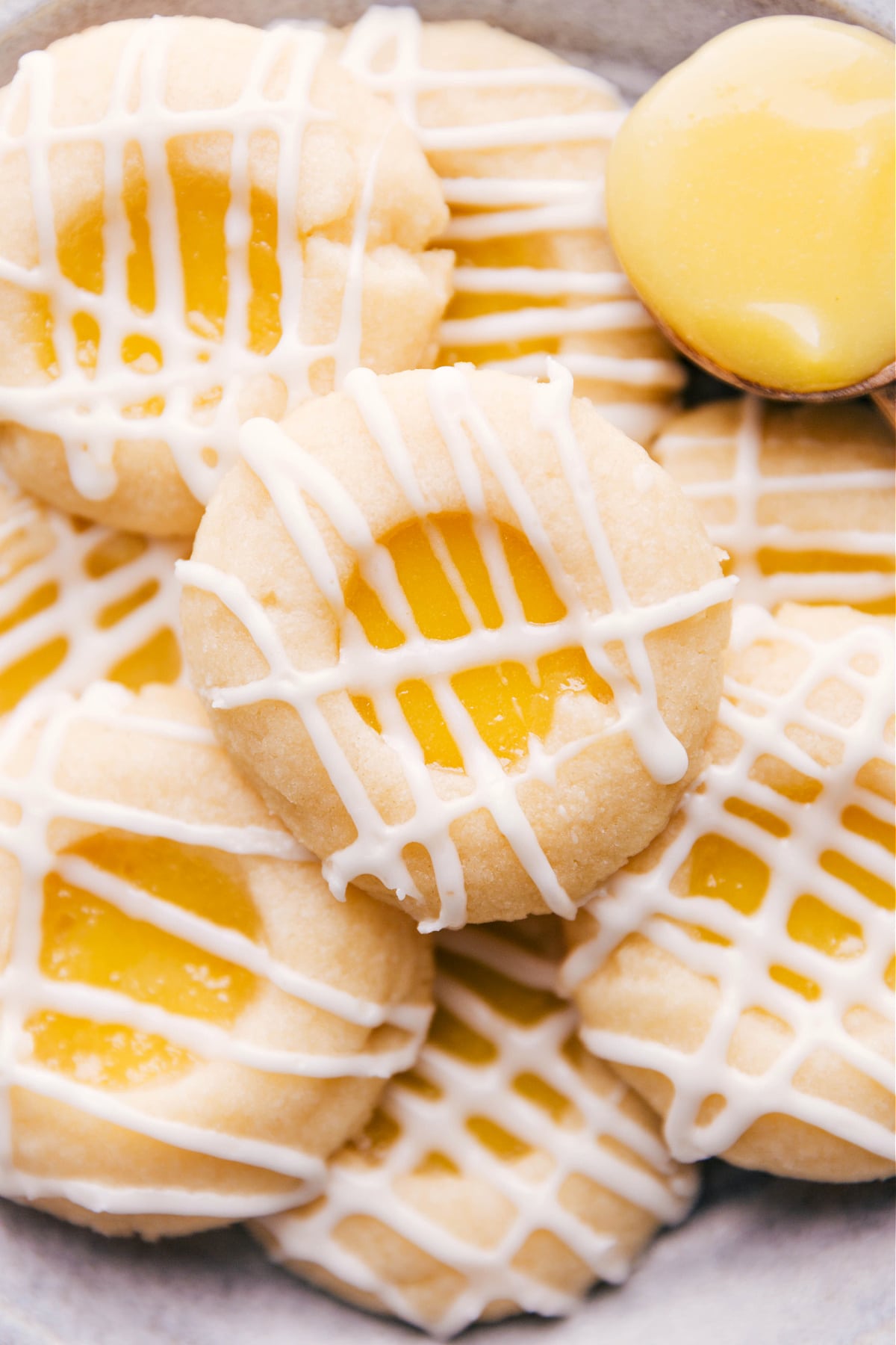 Soft, buttery cookies filled with tangy lemon curd and topped with a light glaze.