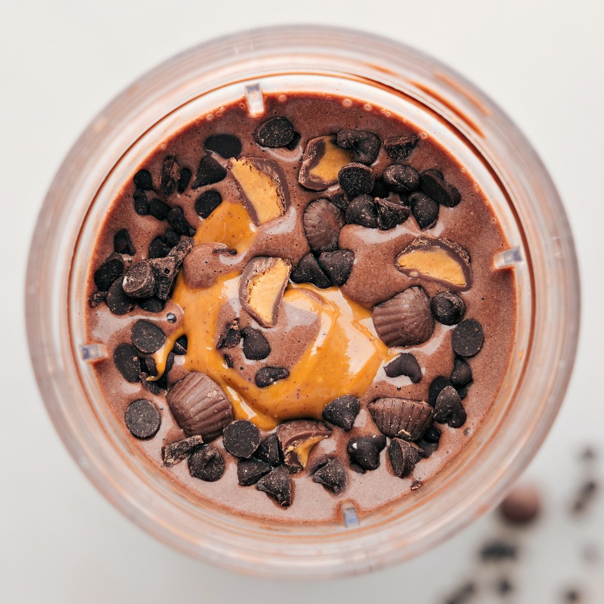 Chocolate peanut butter protein shake with fun toppings like chocolate chips and reeses to give you a high protein treat.