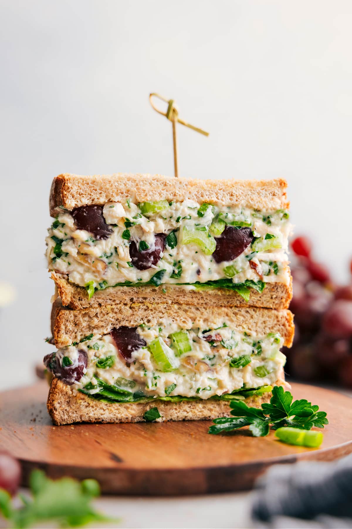 Healthy Chicken Salad Recipe layered into some bread for a delicious sandwich.