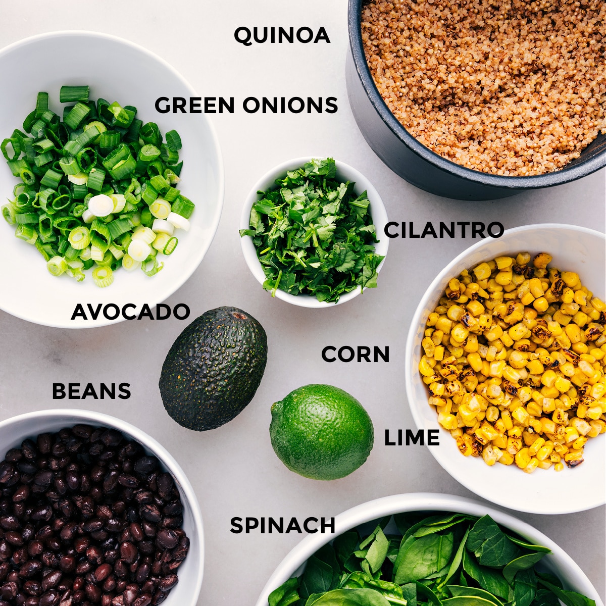 Ingredients in this dish including fresh avocado, crisp corn, black beans, cilantro, and green onions.