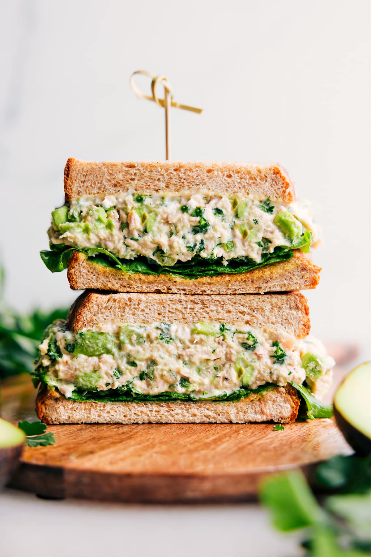 Avocado Tuna Salad sandwich, cut in half and stacked, ready to enjoy.