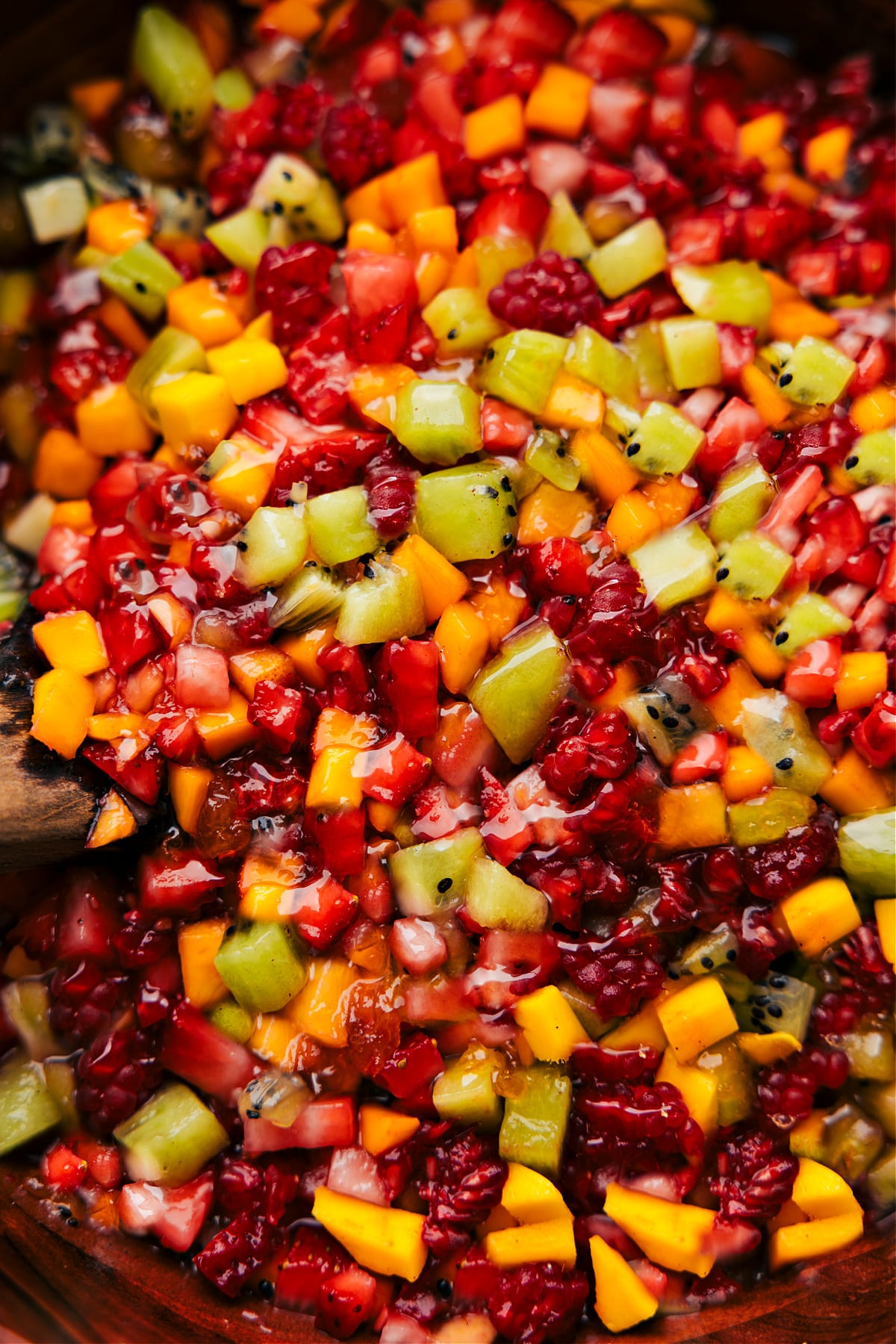 The fruit salsa in a bowl ready to be enjoyed with some cinnamon chips.