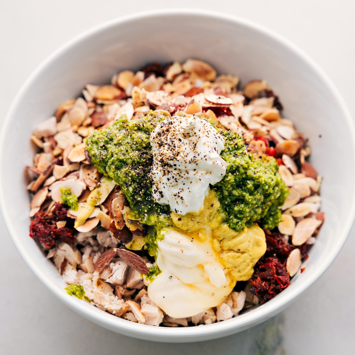 All the ingredients added to a large bowl about to be stirred.