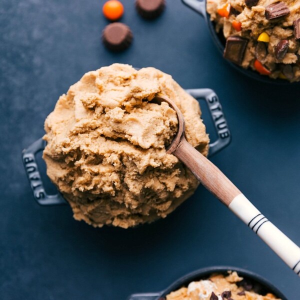 Bowl of creamy dessert accompanied by a spoon, ready for serving.