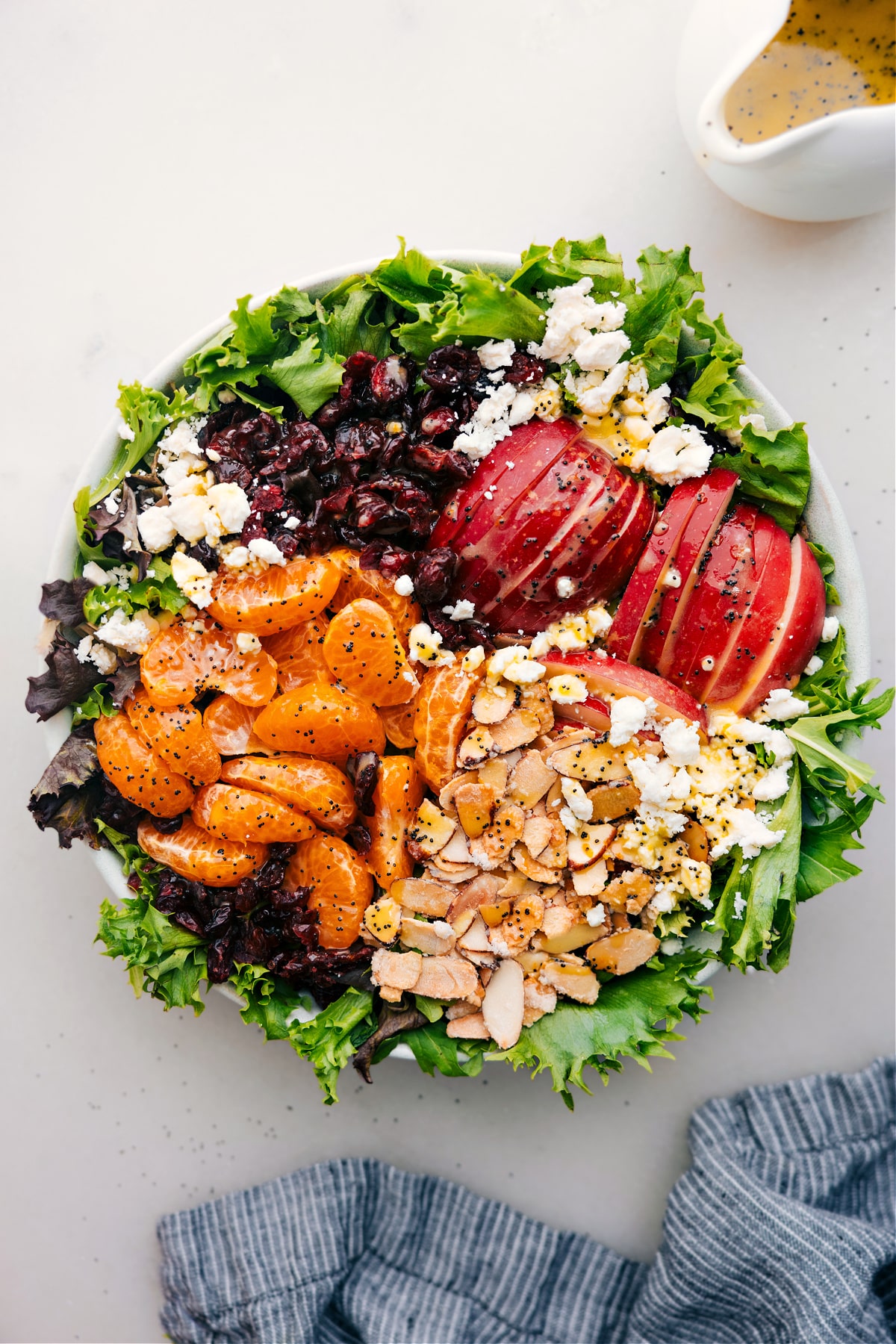 Mandarin Orange Salad in a bowl, dressed and ready to toss together and enjoy.