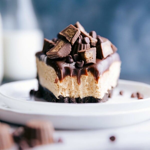 A slice of peanut butter cheesecake no bake with a bite taken out, revealing its soft and creamy interior.