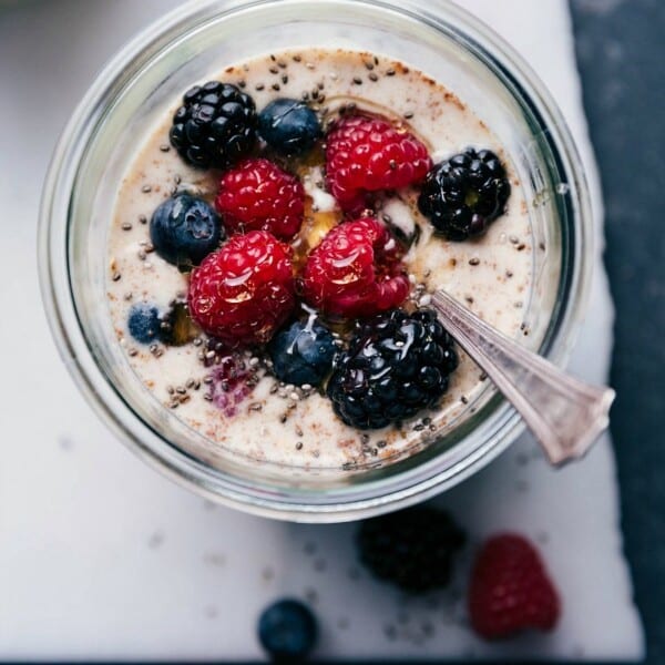 Berry overnight oats, healthy and ready for on-the-go consumption, topped with an assortment of fresh berries.