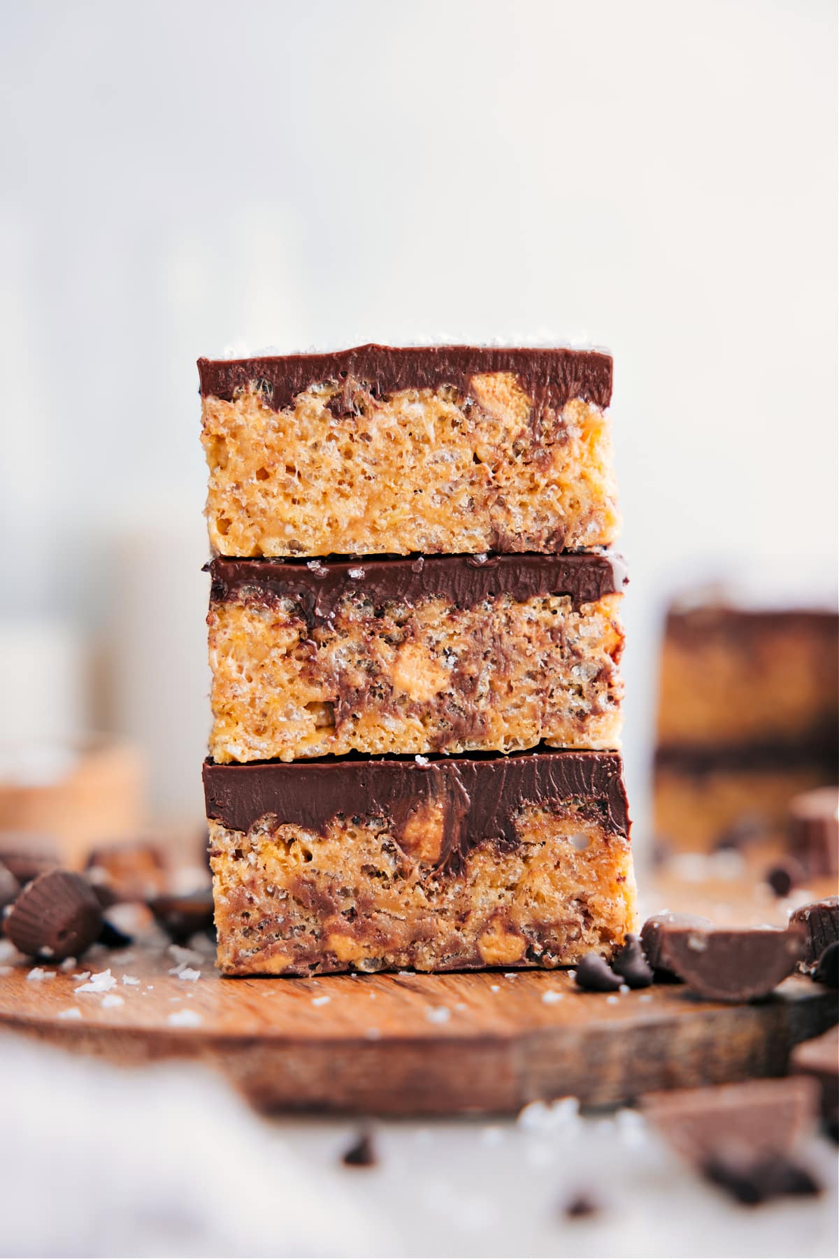 Peanut Butter Rice Krispie Treats cut into squares and stacked on top of each other.