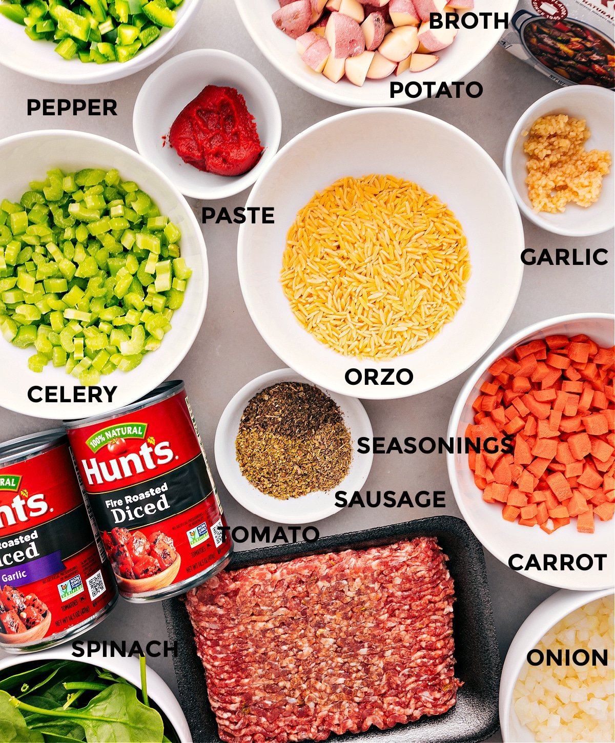 All the ingredients for this recipe are prepped and ready to assemble: pasta, meat, veggies, broth, and seasonings.