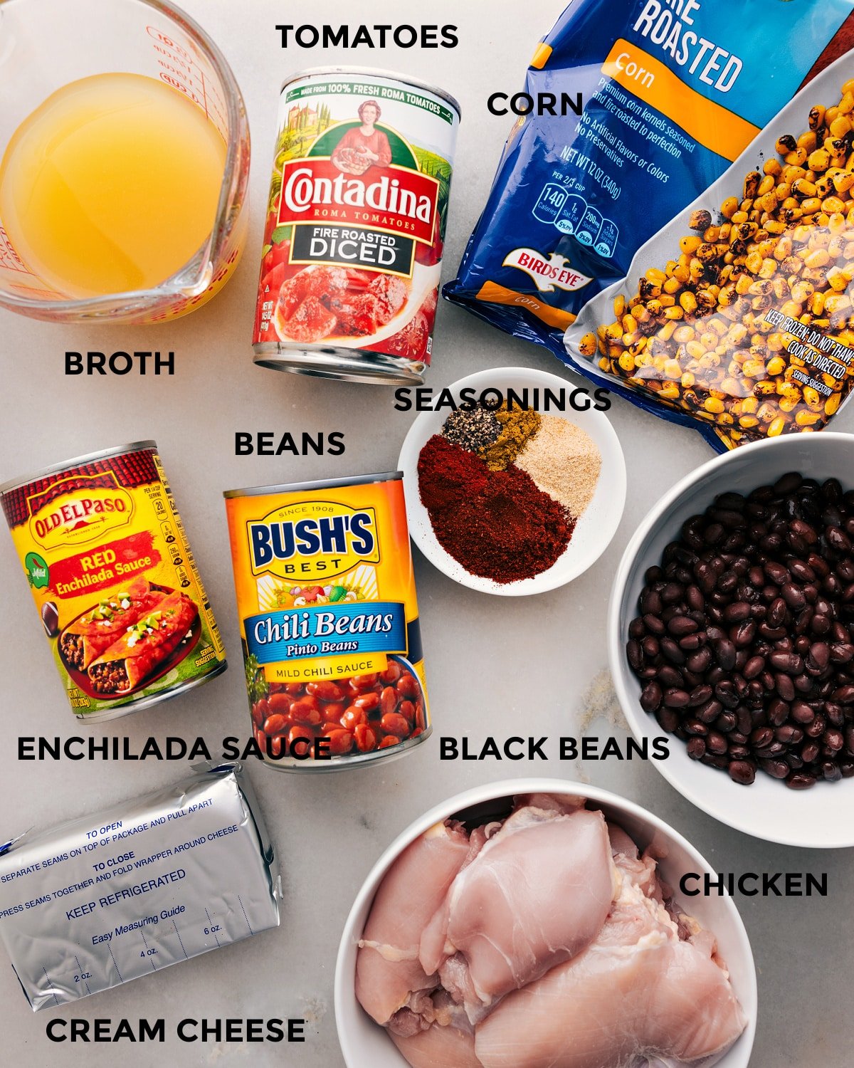 Prep all the ingredients for this recipe, including tomatoes, broth, beans, seasonings, corn, meat, enchilada sauce, and cream cheese, for easy assembly.