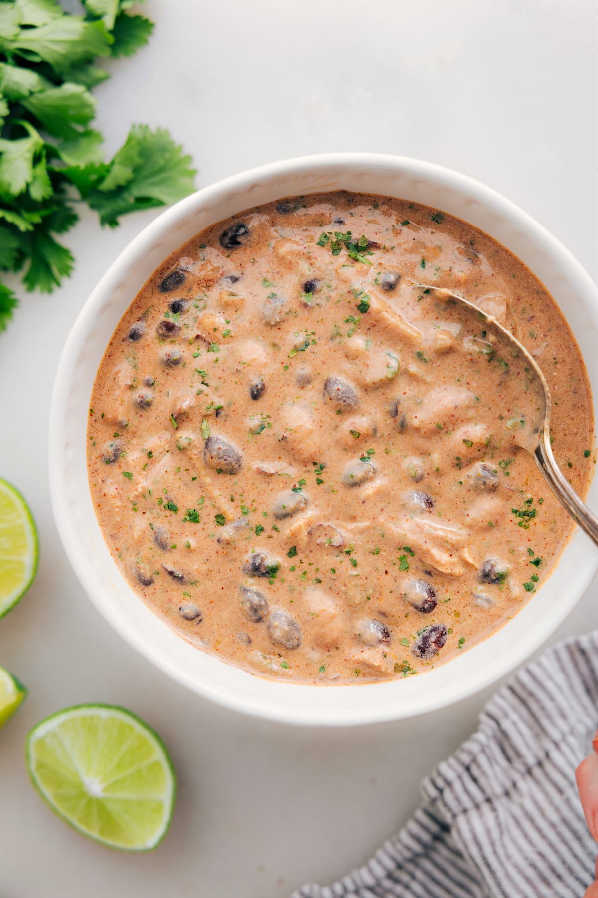 Serve green chicken enchilada soup in a bowl and enjoy.